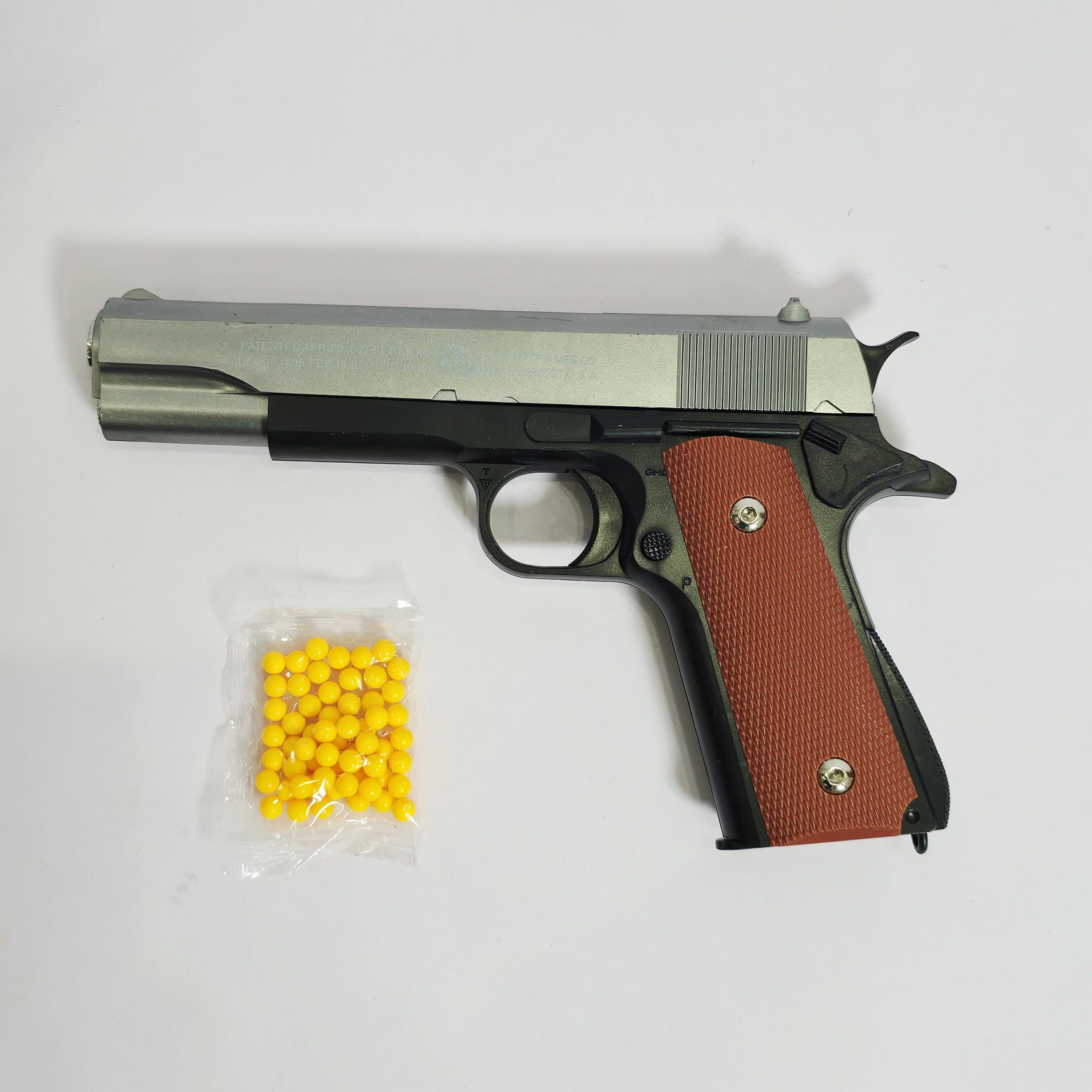Colt M1911 Replica Toy Pistol – Two-Tone Spring-Powered Blaster with Wood-Grain Style Grips - Image 3