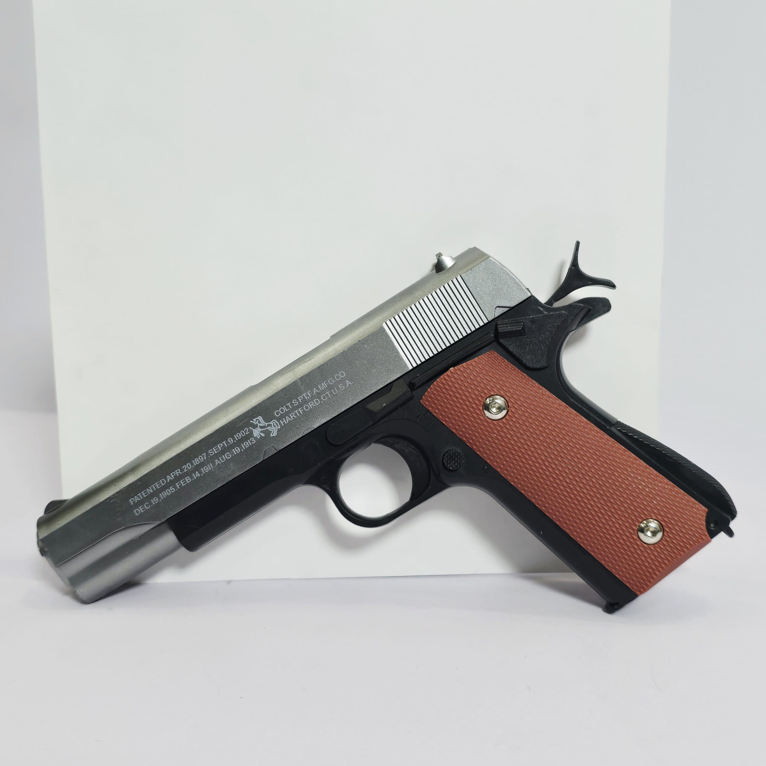 Colt M1911 Replica Toy Pistol – Two-Tone Spring-Powered Blaster with Wood-Grain Style Grips - Image 2